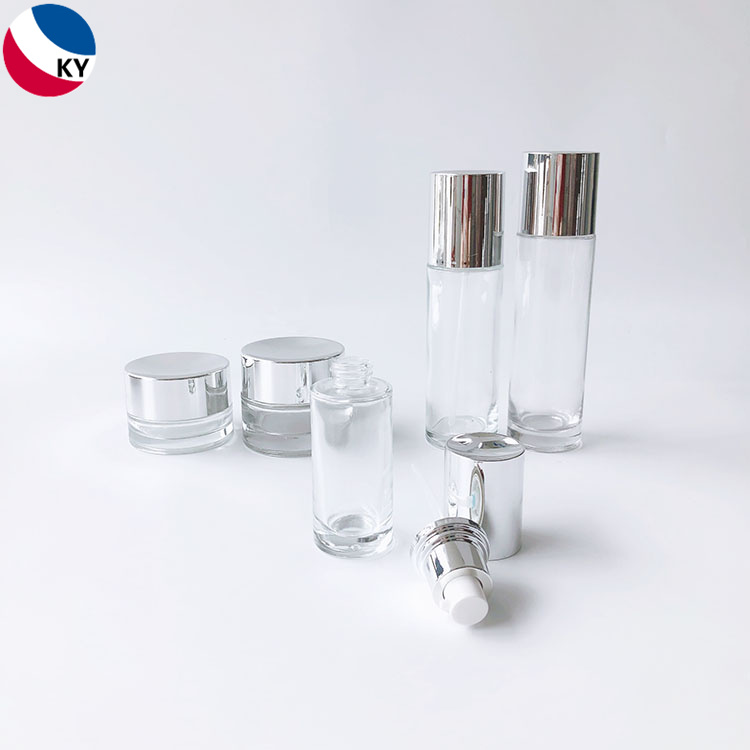 Luxury Cosmetic Packaging Sets Cylinder 30g 50g 30ml 50ml 100ml Cream Jar Clear Glass Pump Bottle with Silver Pump
